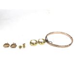A collection of 9ct gold items including a bangle