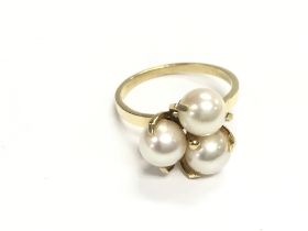 A 14ct gold ring set with pearls. Approx size P an