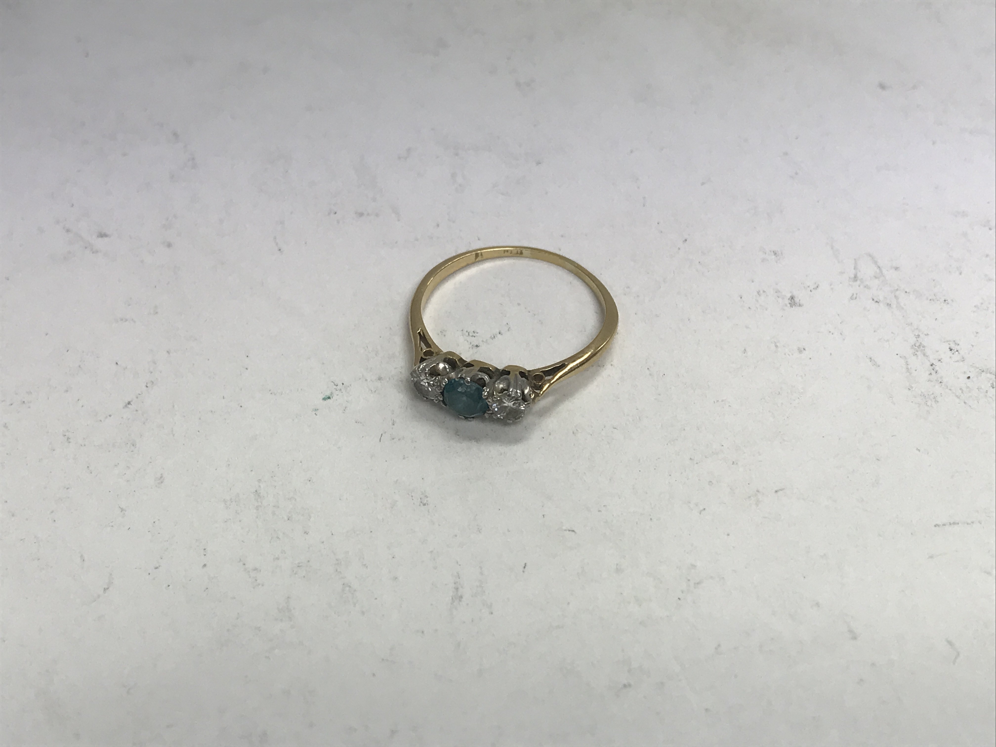 An 18ct diamond and aquamarine set ring. Approx we