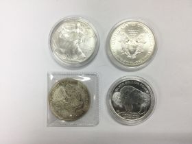 Four American 1oz silver dollars. Shipping categor