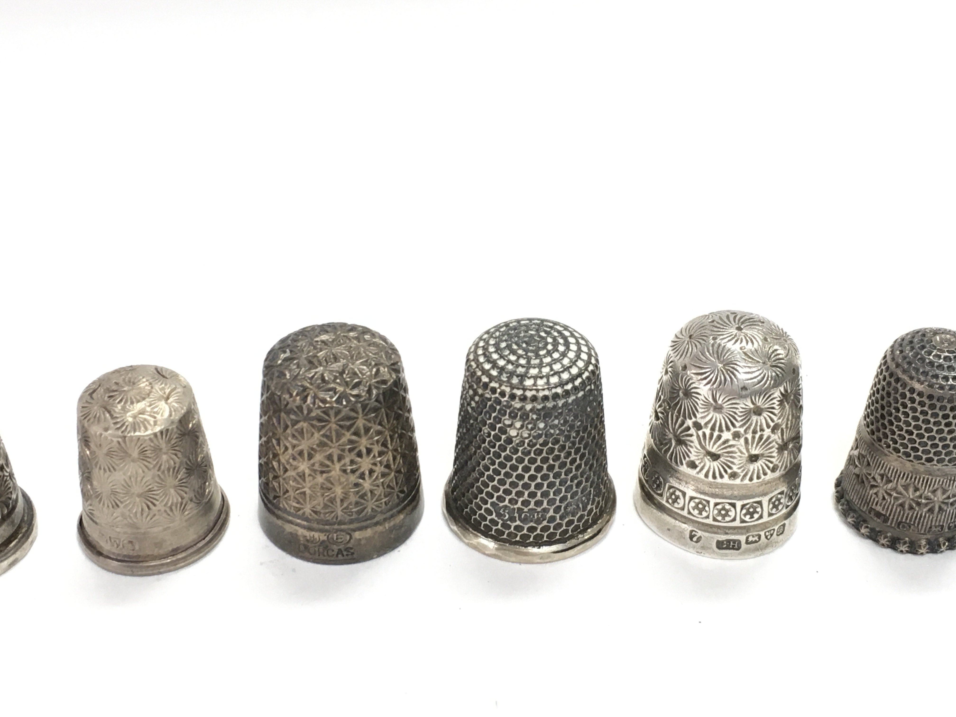 A collection of 12 Charles Horner silver thimbles. - Image 3 of 4