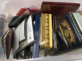 A box of collectors coins and other loose coinage.