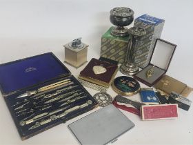A Collection of items including compact mirrors, l