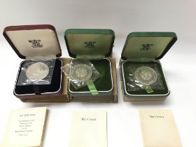 Three silver coins including two 1972 crowns and a