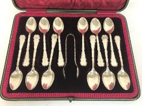 A set of twelve silver spoons in a fitted case, po