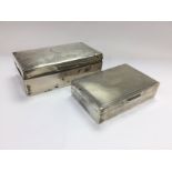 A silver cigarette box and a smaller silver exampl