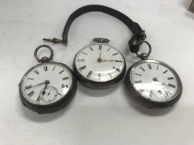 Three silver pocket watches.