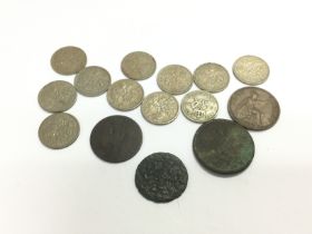 A small collection of coins including a Charles I