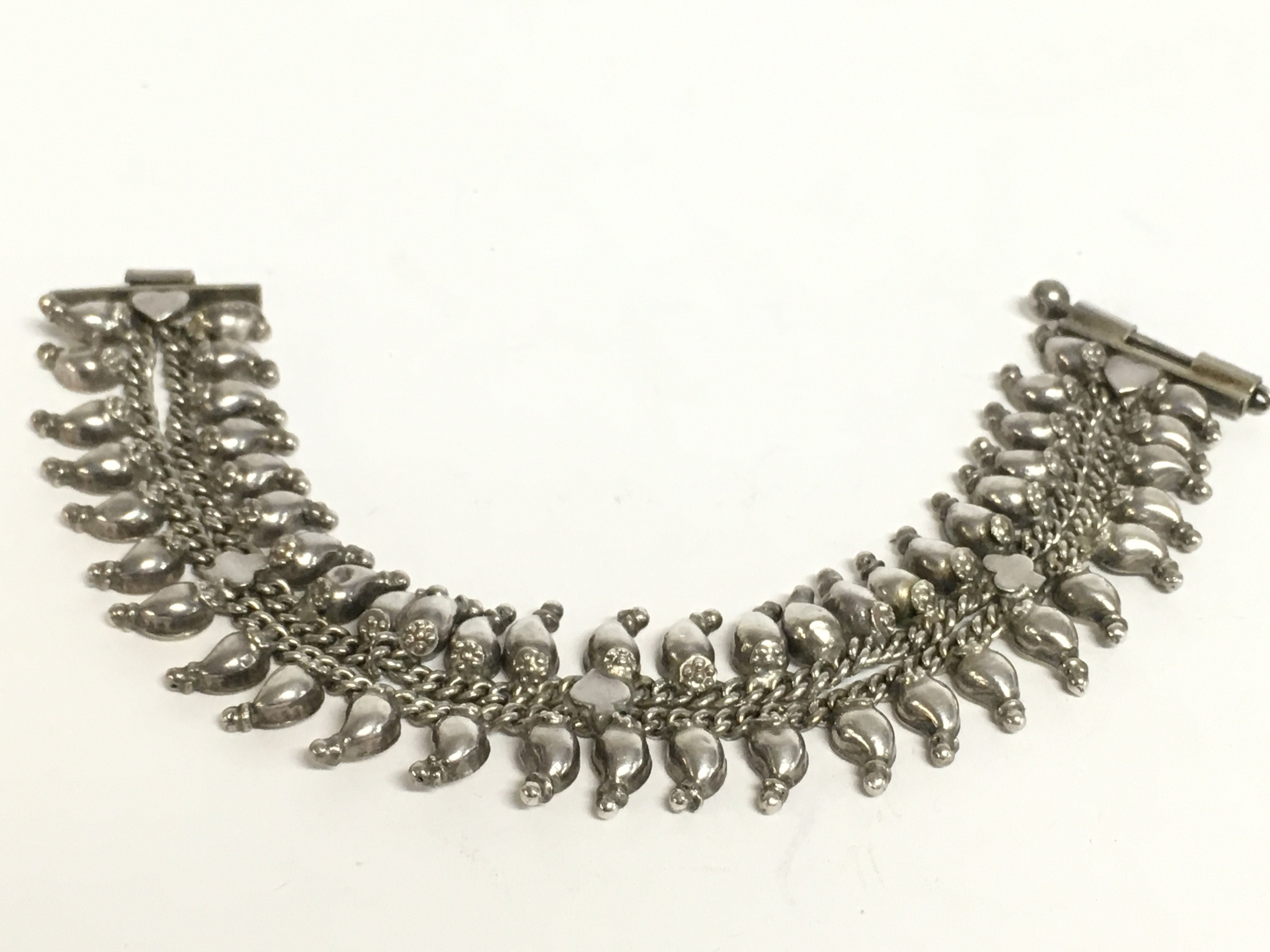 An Indian silver mango bracelet. Postage category