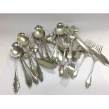 A collection of silver cutlery. 1710g Total. Posta