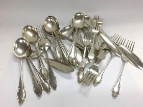 A collection of silver cutlery. 1710g Total. Posta