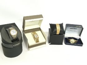 A collection of boxed watches including a Citizen