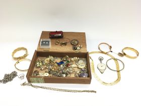 A box of costume jewellery including 9ct gold meta