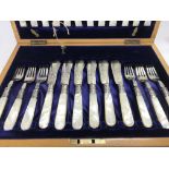 A cased set of silver fish knifes and forks with m