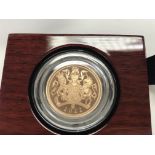 A 2022 gold proof sovereign. Postage B