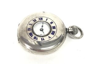 A silver vintage pocket watch. Winds and runs. App