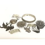 A collection of silver jewellery including brooche