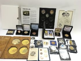 A collection of commemorative coinage and replica