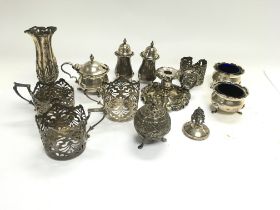 A collection of assorted silver items including sh