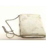 A silver hallmarked card case on chain , 101g. Pos