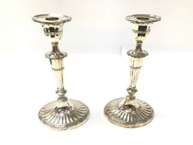 A pair of silver candlesticks by Mappin and Webb.