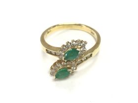 A 14ct emerald and diamond ring. Size P and 4.11g.