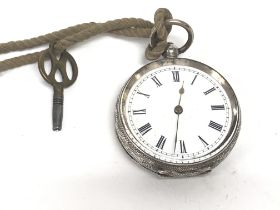 A silver pocket watch. Winds and runs. Approx 36mm