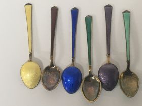 A set of multi coloured enamel and sterling silver spoons. NO RESERVE