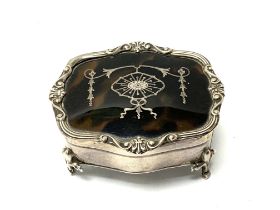 A small hallmarked silver and tortoiseshell trinket box with pique work decoration. (B)