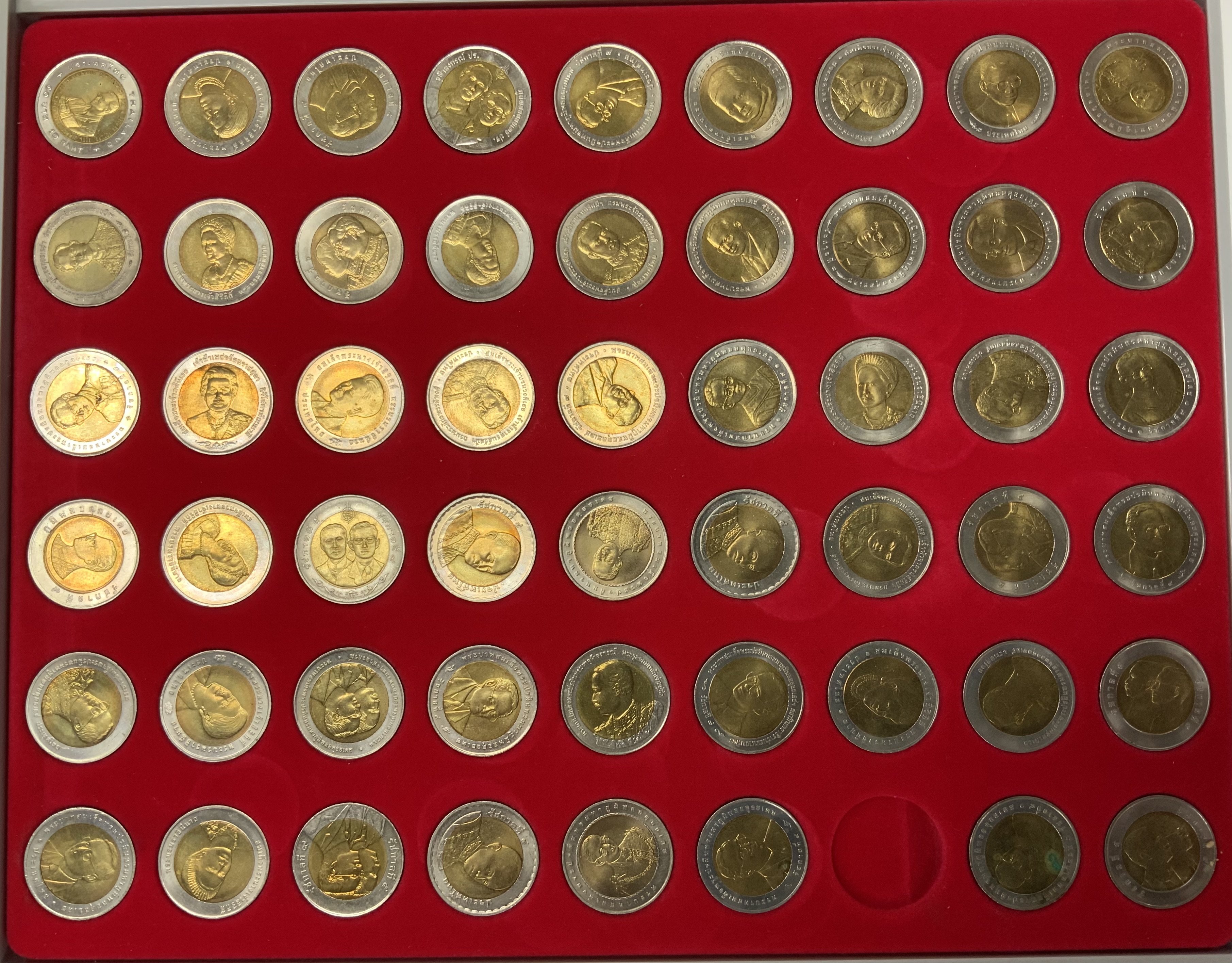 A tray of Thai 10 Baht bi metal coins. (B)