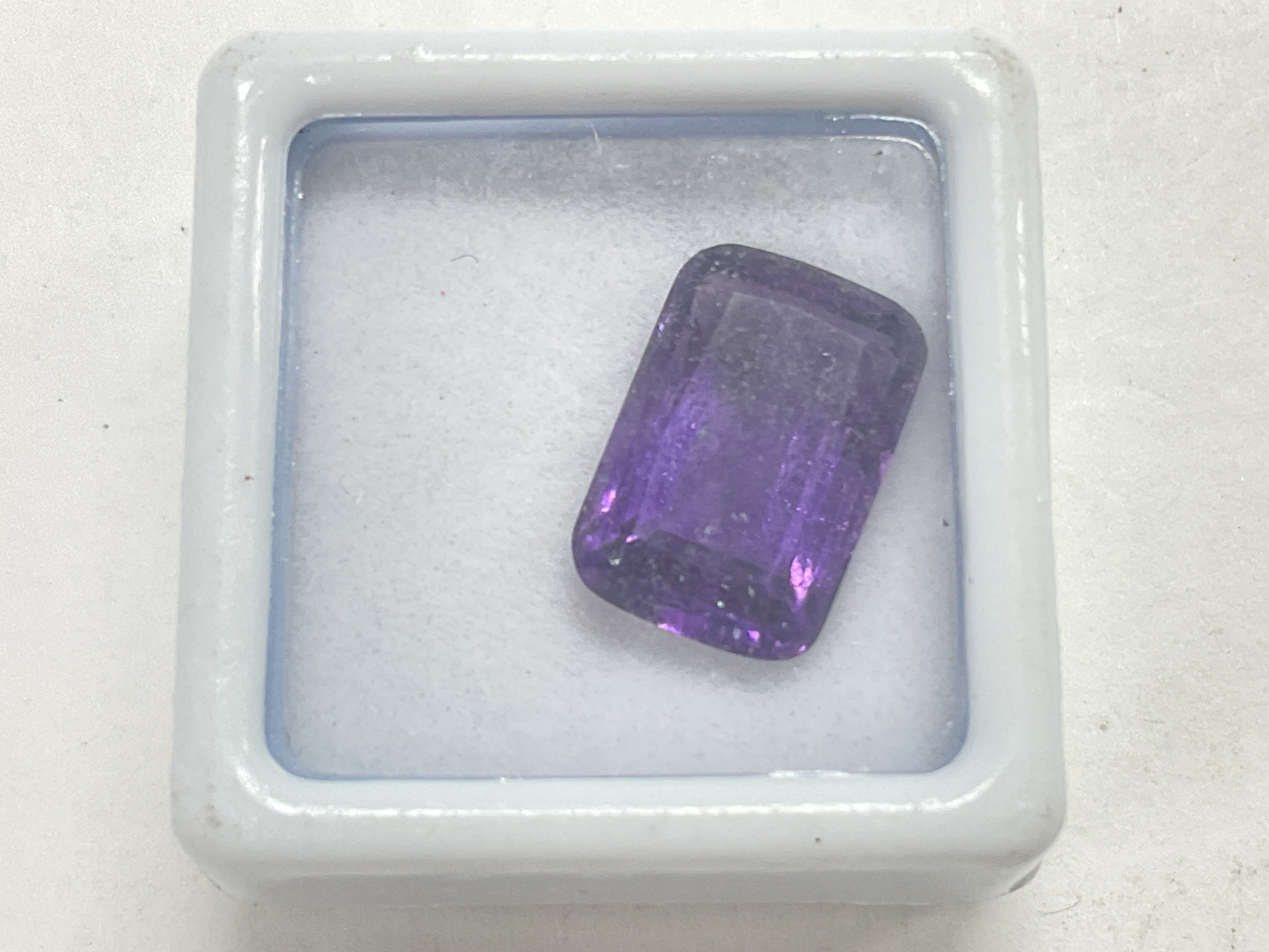 A single unmounted rectangular 6.20ct amethyst, bo