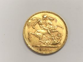 A 1885 full gold sovereign. Postage A