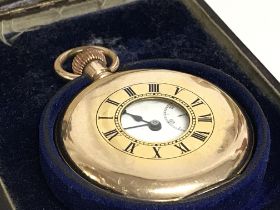 A gold plated half hunter pocket watch dated 1908.