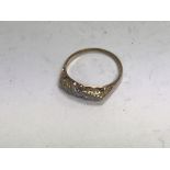 An 18ct gold five stone diamond ring. Approx weigh