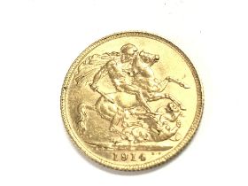 A 1914 full sovereign. Postage A