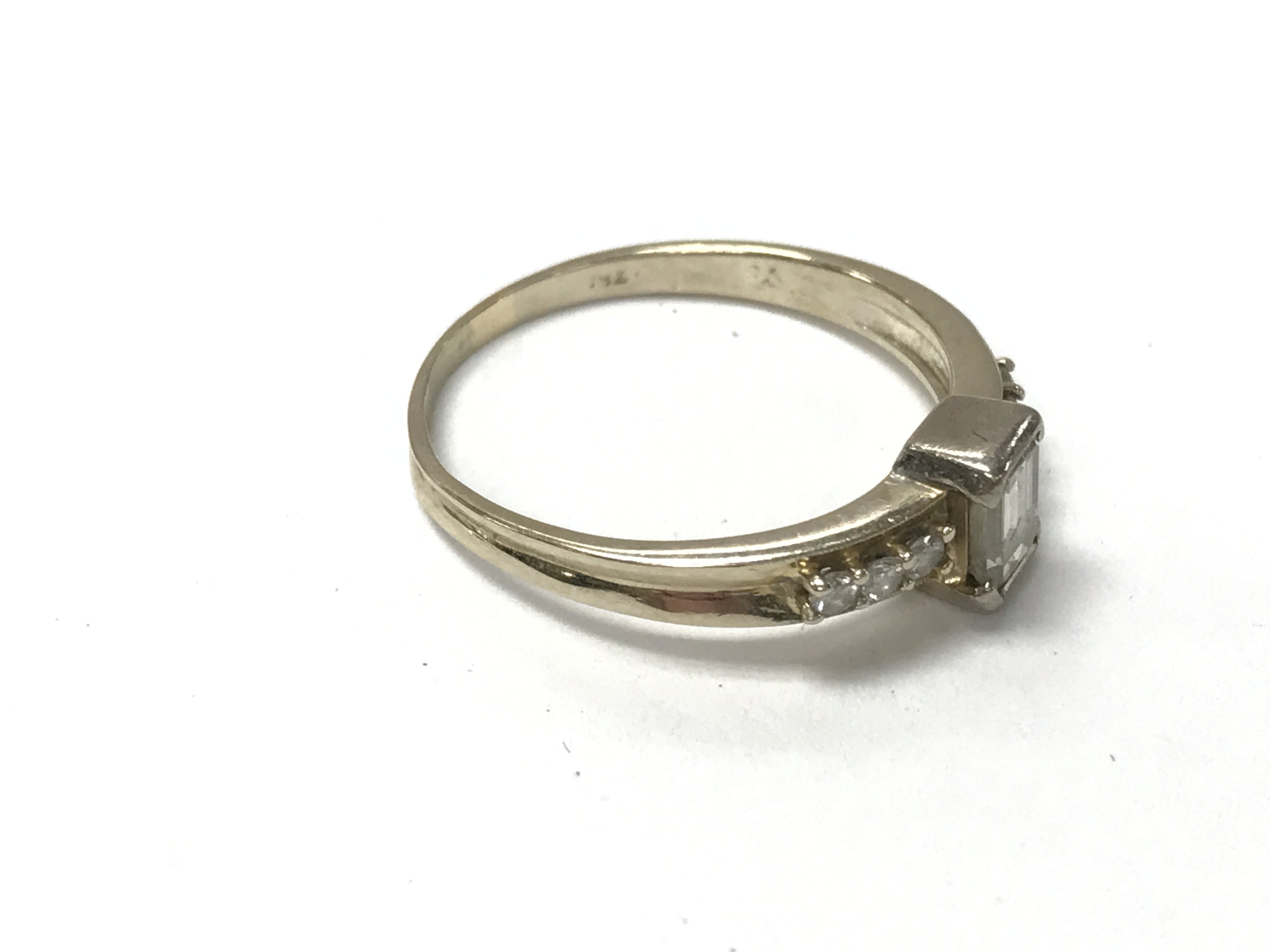 A 14ct gold ring set with a baguette diamond and s - Image 2 of 2