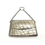 A Sampson Mordan silver purse. 10cm wide by 7cm.