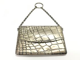 A Sampson Mordan silver purse. 10cm wide by 7cm.