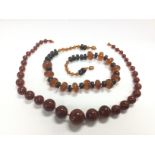 Two amber necklaces, one with graduating beads. To