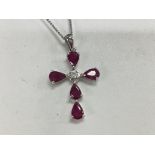 14ct white gold cross pendant set with pear shaped