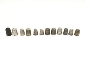 A collection of 12 Charles Horner silver thimbles.
