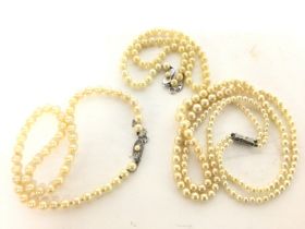 Simulated pearl necklaces with silver clasps. Post