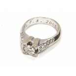 18ct white gold ring central diamond with further