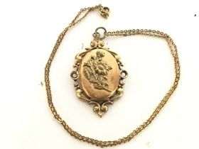 A French rolled gold opening locket and chain.post