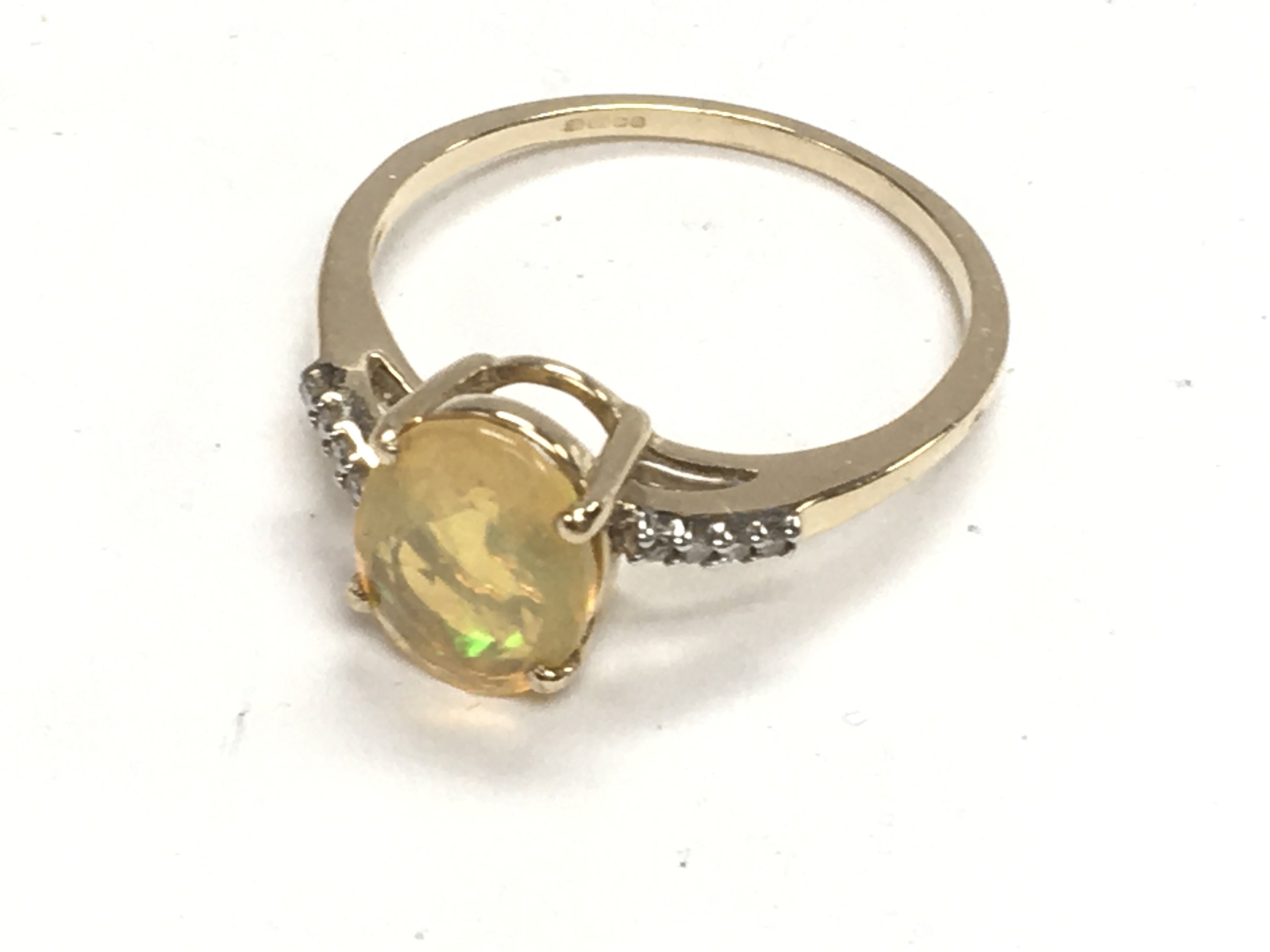 9ct yellow gold oval cut yellow opal ring with dia