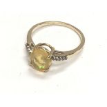 9ct yellow gold oval cut yellow opal ring with dia