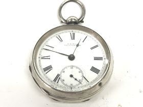 A silver Waltham pocket watch. Winds and runs. App