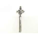 A silver rattle in form of a soldier. Approx 13cm.