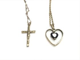 A 9ct gold chain with cross pendant and a 9ct chai