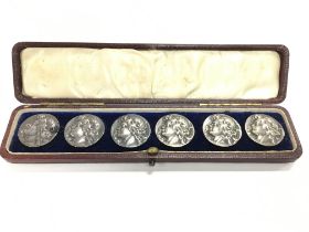 A boxed set of six silver art nouveau buttons.Post